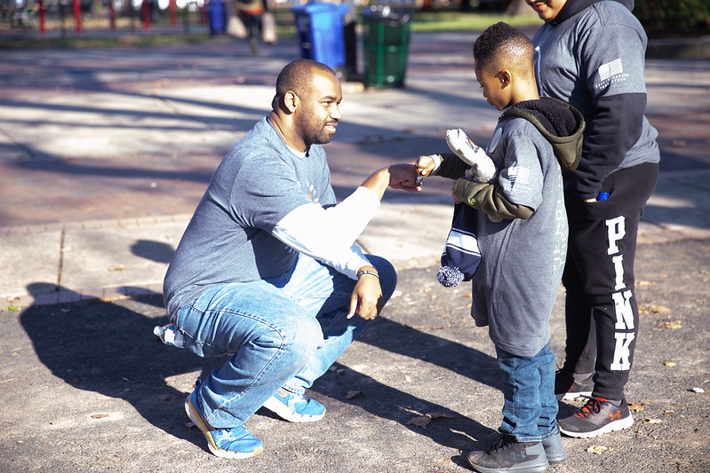 Travis Manion Foundation does hand puppetry with youngster