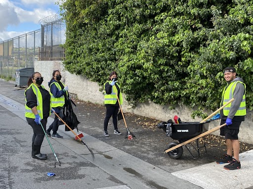 Just Us 4 Youth participants clean the streets of their city