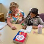 Palmetto Literacy Council volunteer tutor Bonnie works with Jasmine