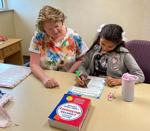 Palmetto Literacy Council volunteer tutor Bonnie works with Jasmine