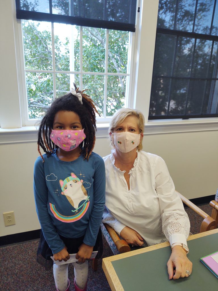 Palmetto Literacy Council volunteer tutor Phyllis Bailey works with young girl