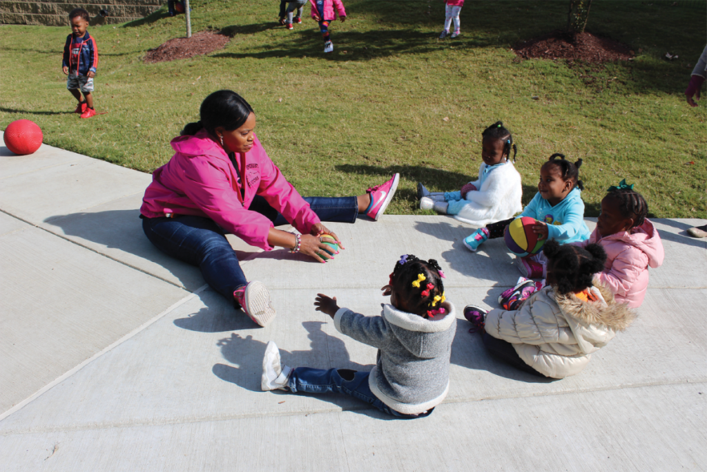 Preschool children play ball at Porter-Leath