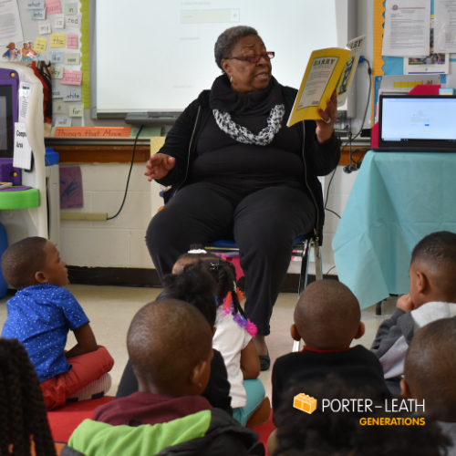 Foster Grandparent reads to children at Porter-Leath