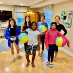 Supporting Kidds group photo with beach balls