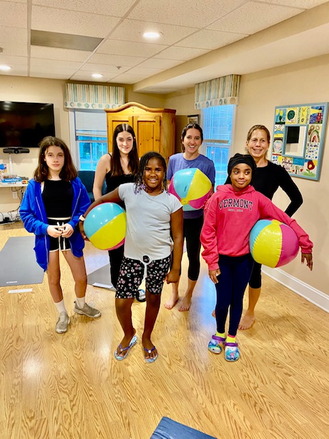 Supporting Kidds group photo with beach balls