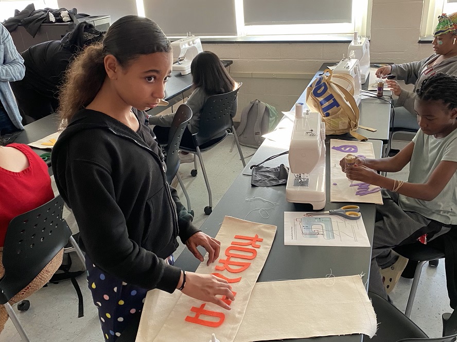 TCP Youth Empowerment participant plays letter game