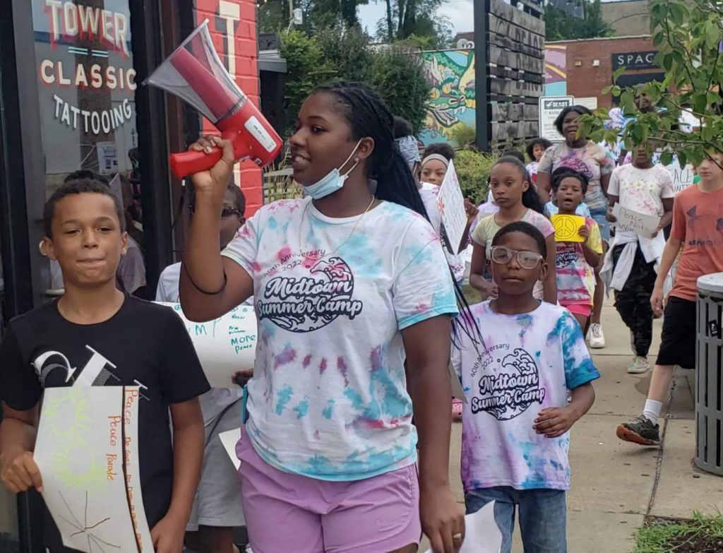 Midtown summer camp participants parade