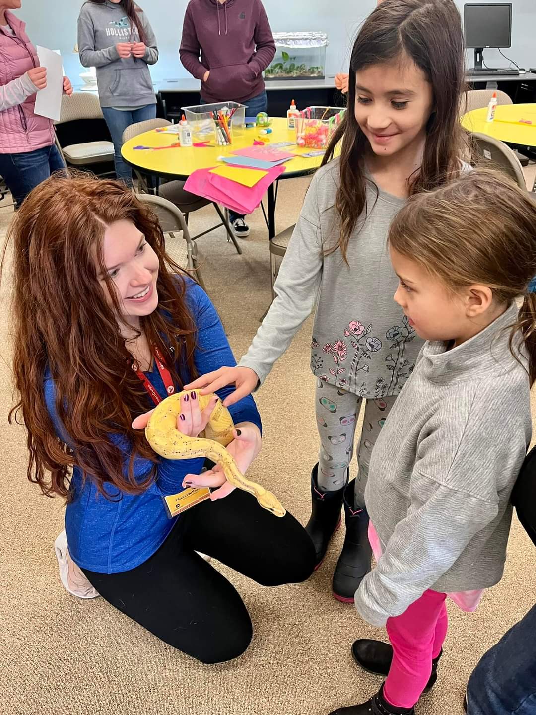 Children at The Science Zone pet a snake