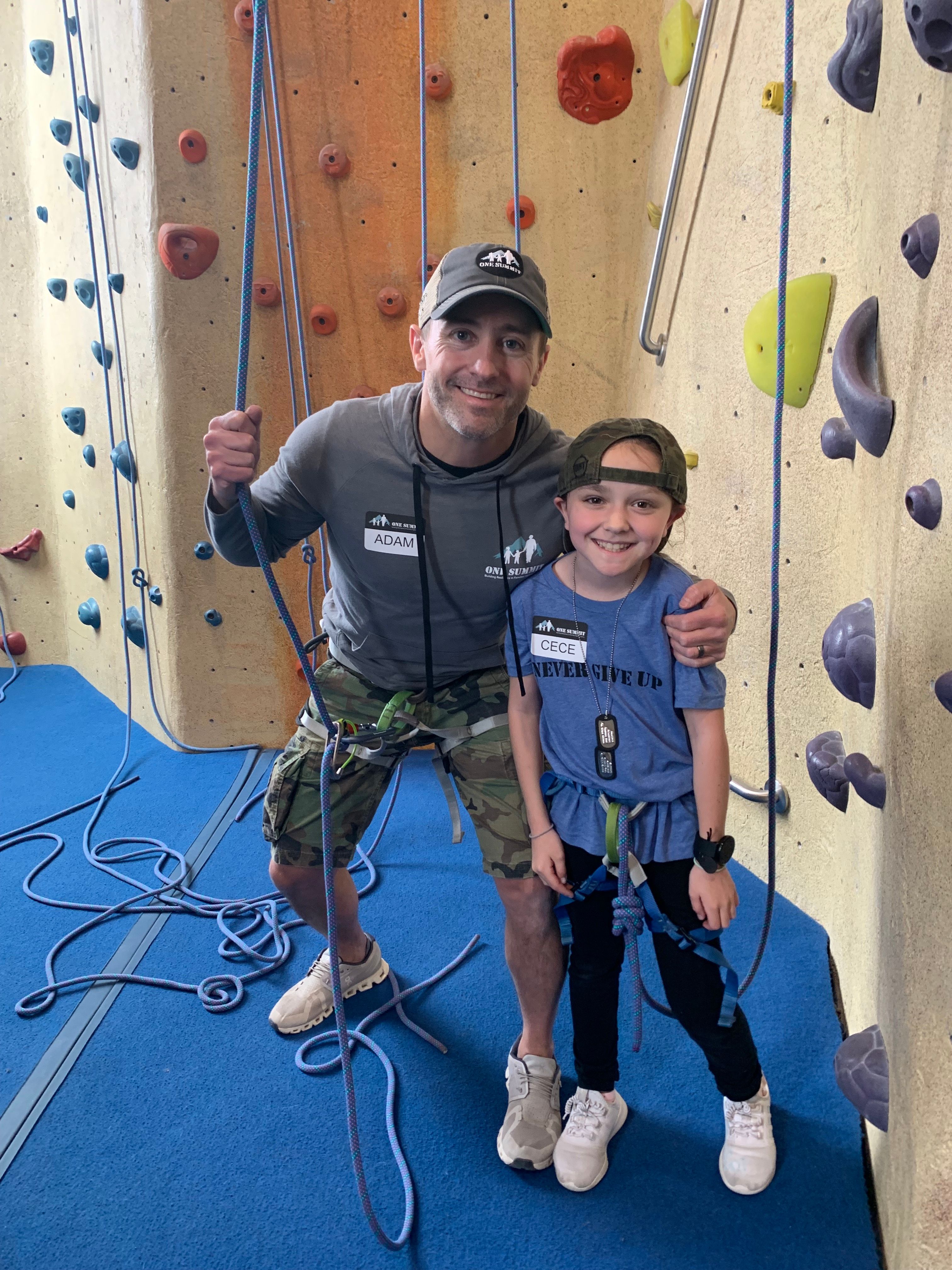 Navy SEAL with One Summit mentee after indoor rock climbing success