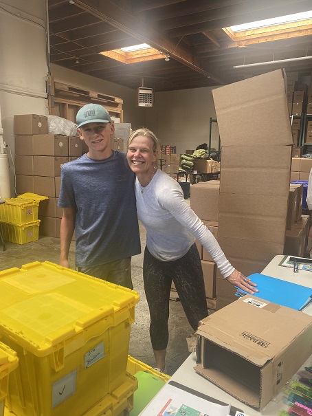 volunteers pack school supplies and backpacks on behalf of Sydney Paige Foundation