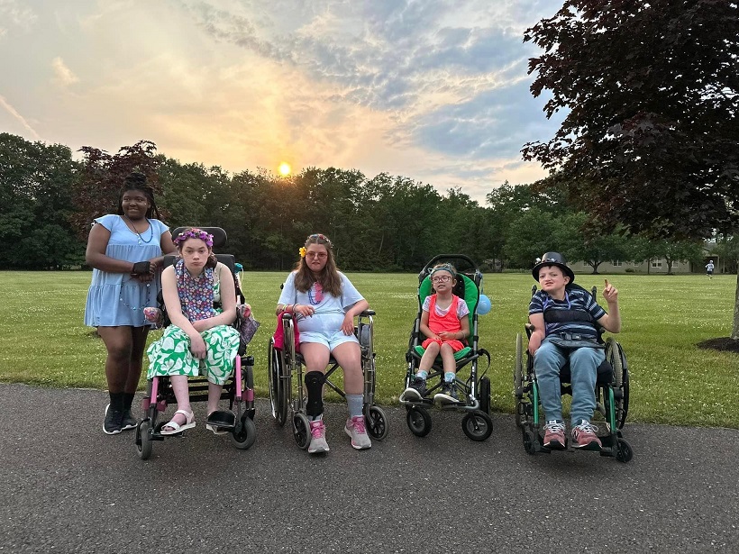 Camp Cranium wheel chair bound campers outing volunteer