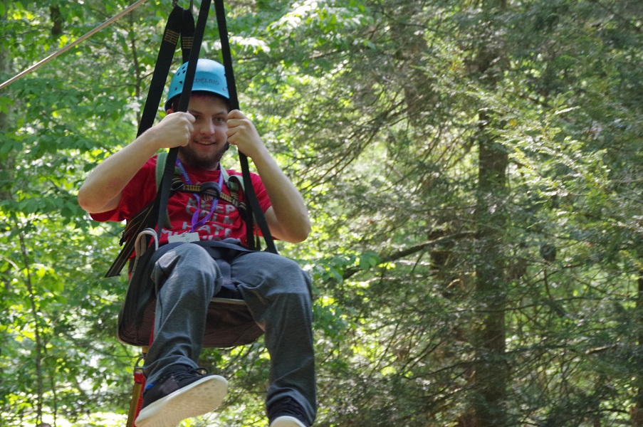 boy in adaptive zipline