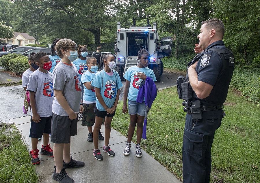 Community service Marietta PAL officer and children