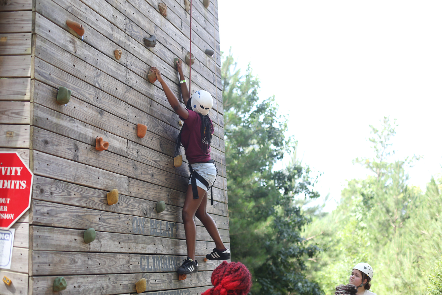 H.E.R.O. for Children participants enjoy climbing a rock climbing wall