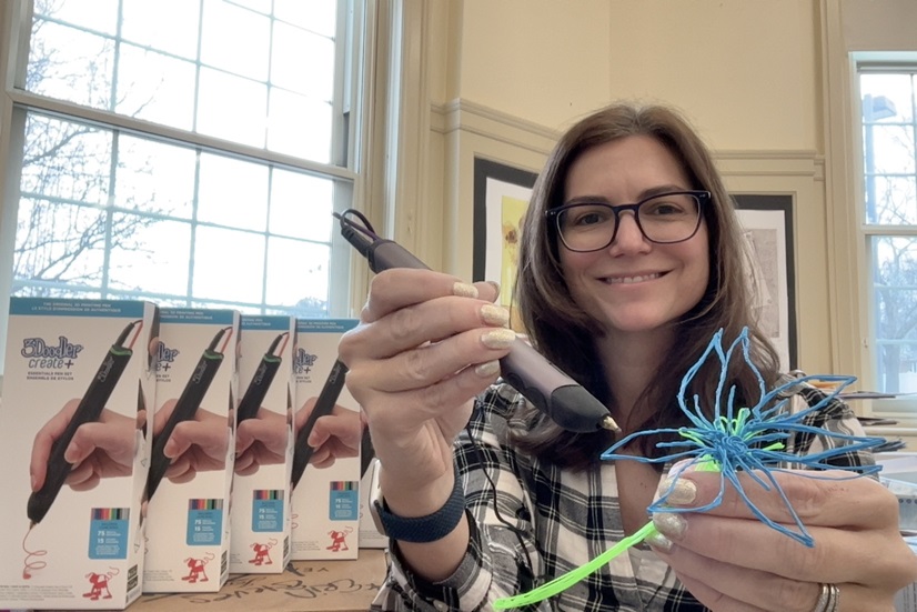 Smiling educator with art supplies from a Florham Park Education Foundation grant