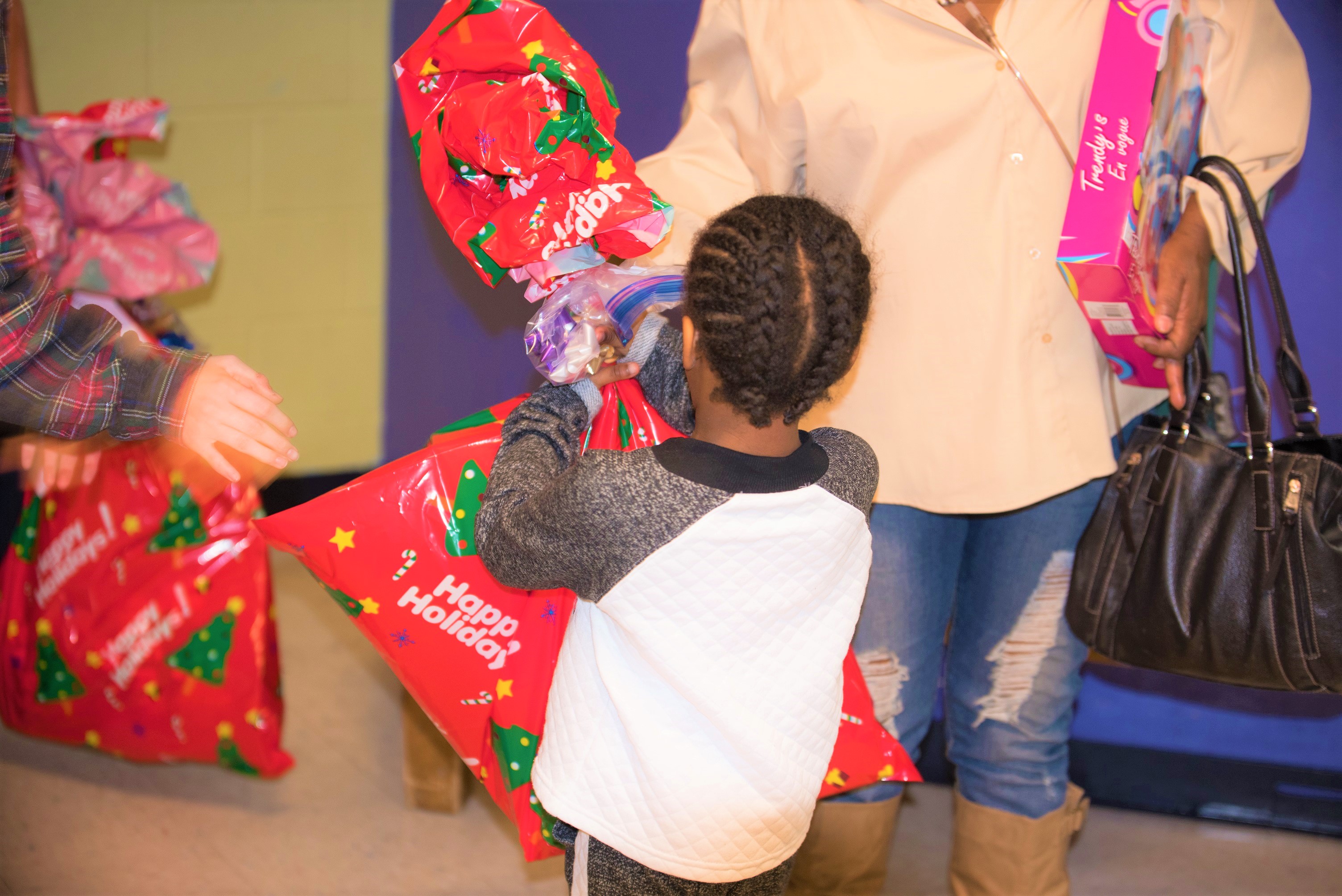 H.E.R.O. for Children participant received wrapped gift