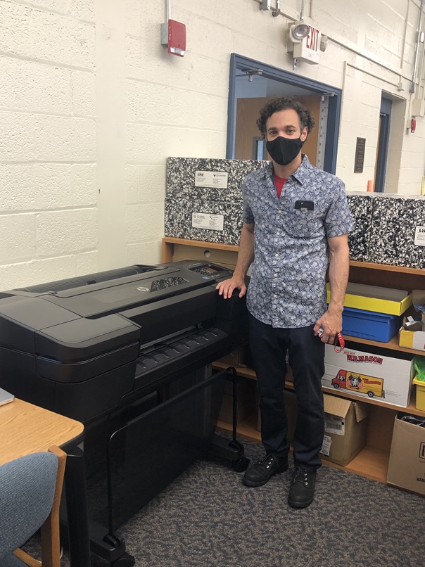 Mr. Russo displays educator grant-provided 3D printer