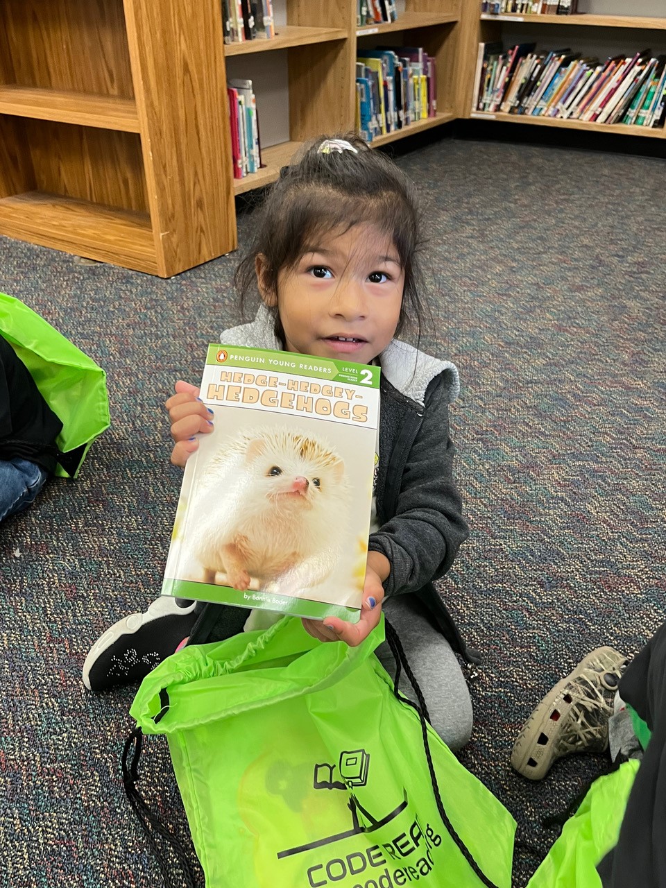 Cute girl shows off book