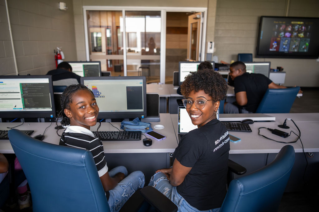 CodeCrew smiling teacher and student