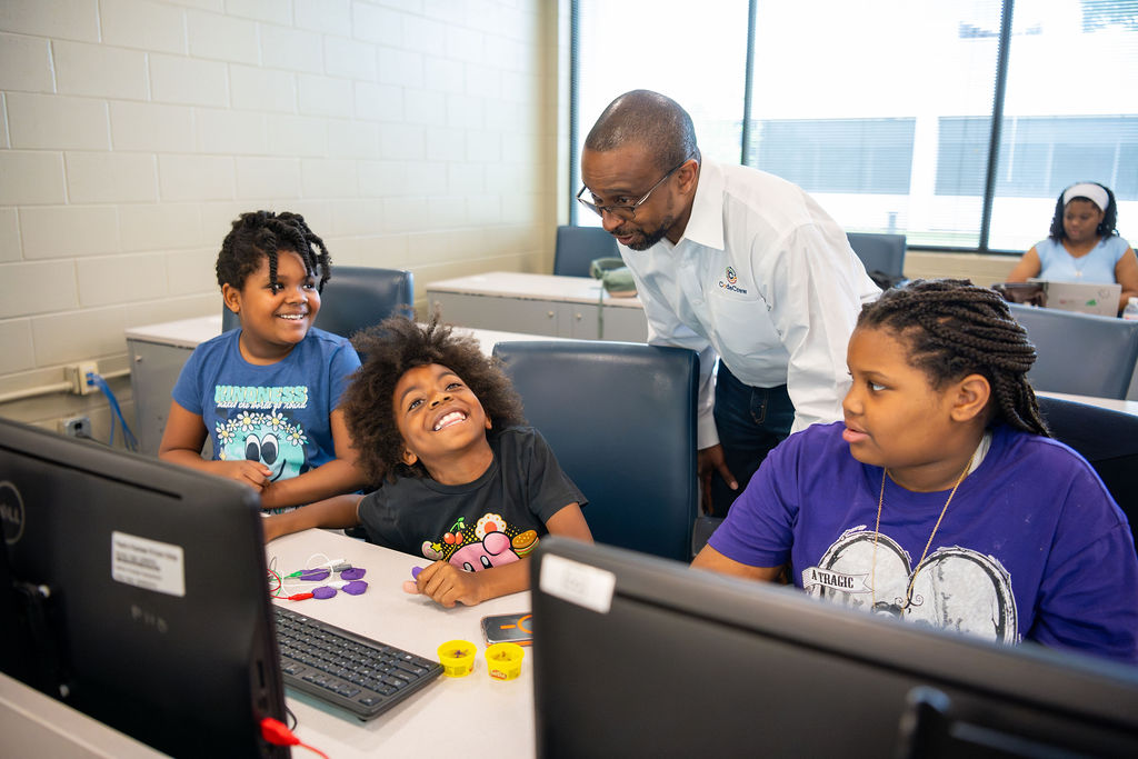 CodeCrew teacher works with students