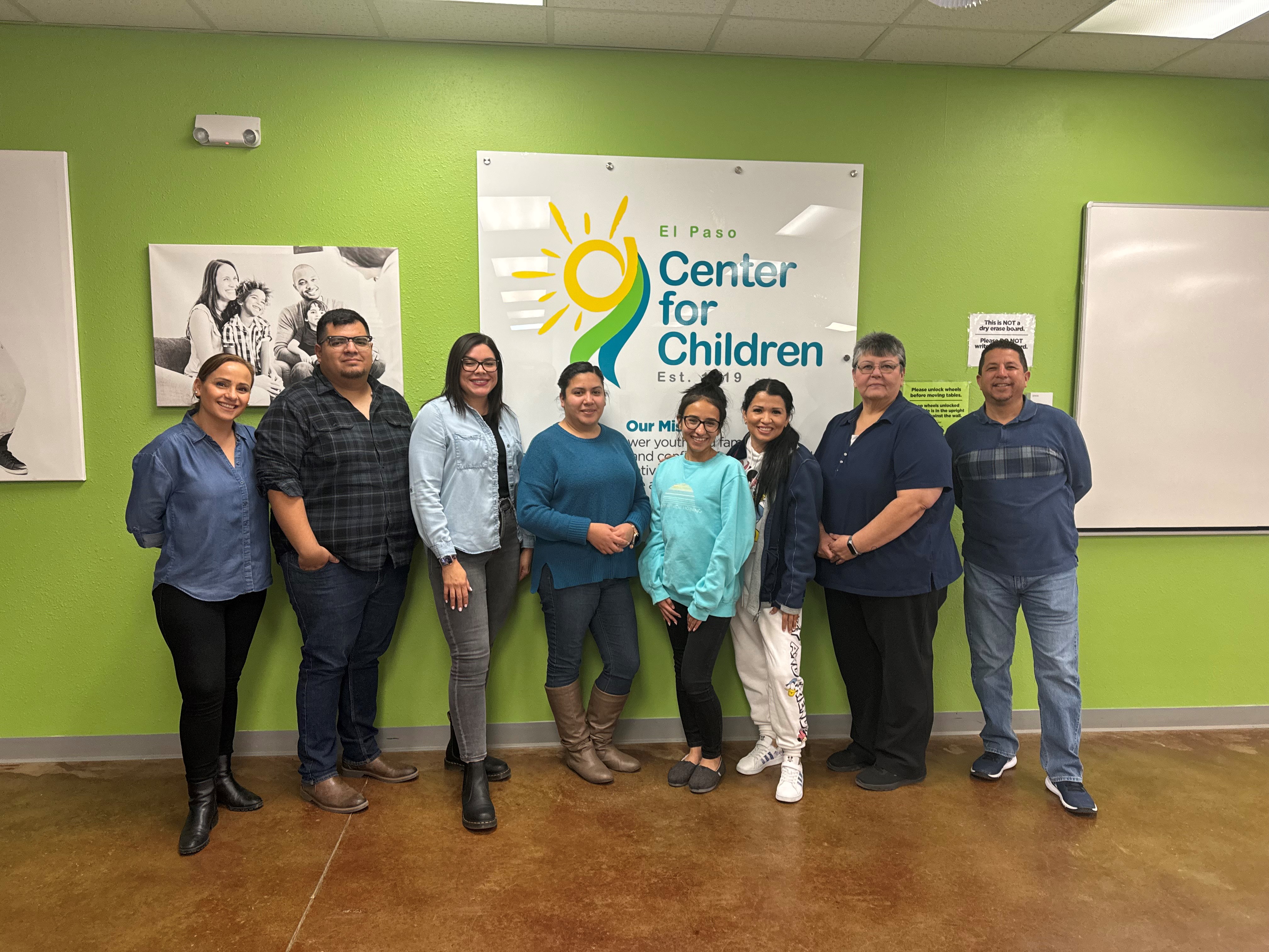 EPCC staff wearing blue posing together for National Wear Blue Day 2024 inside the center.