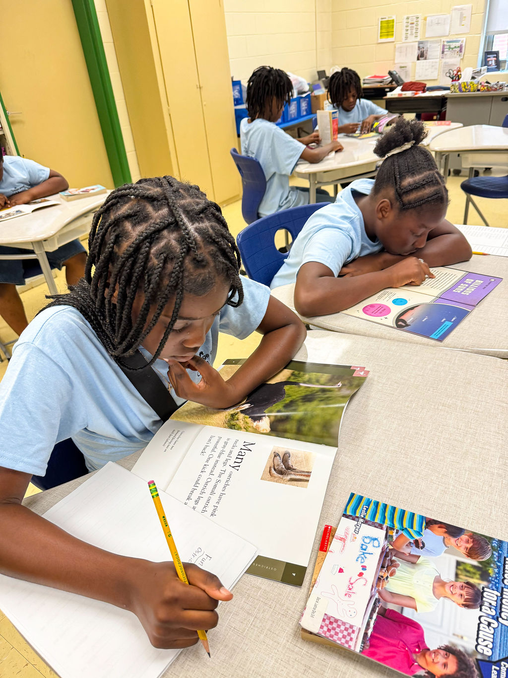 The Village Group kids doing homework after school