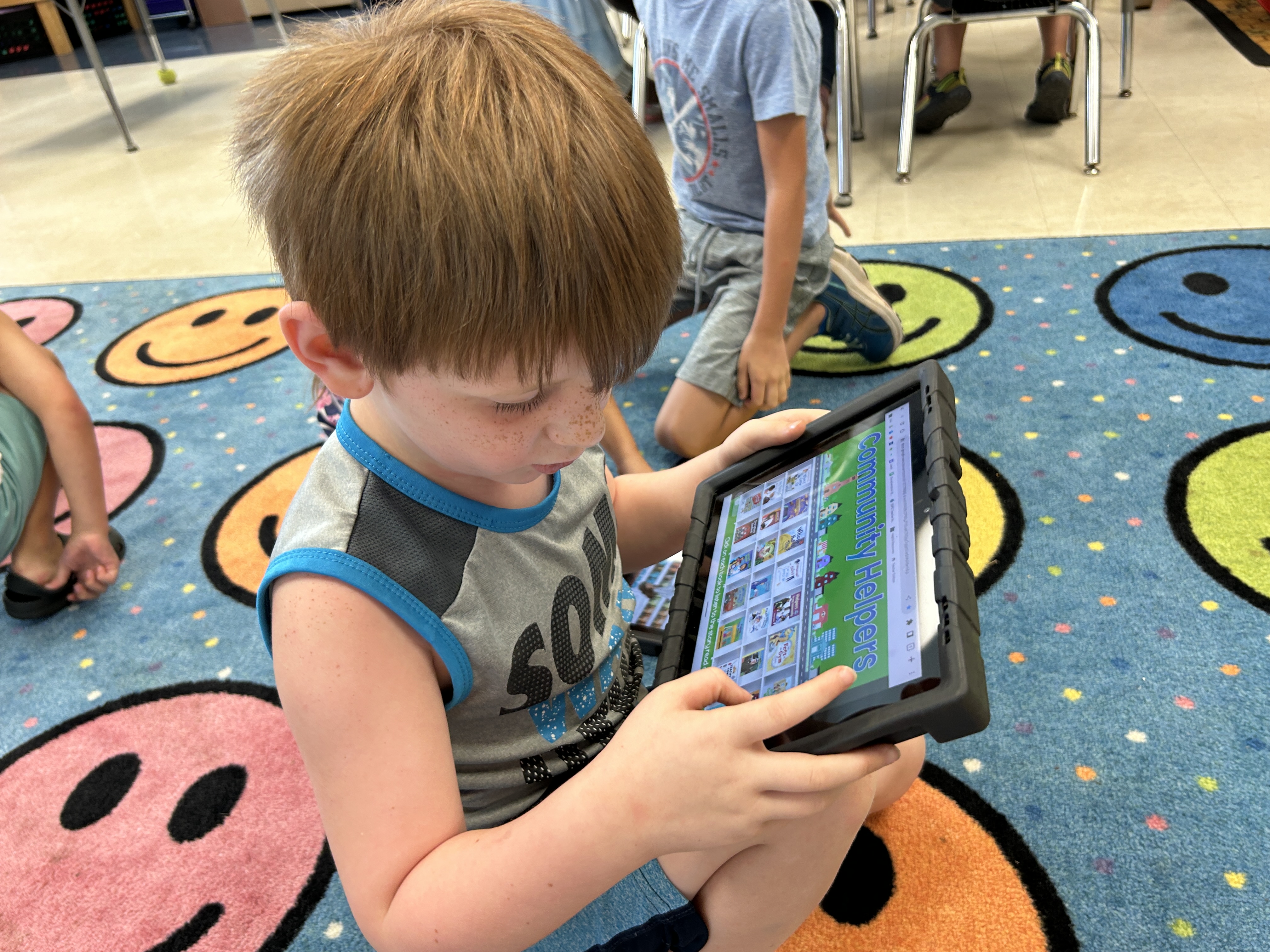 young boy works on reading at United Way of Pickens County