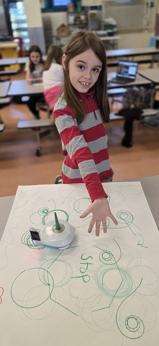 STEM Coding Lab girl shows off her work