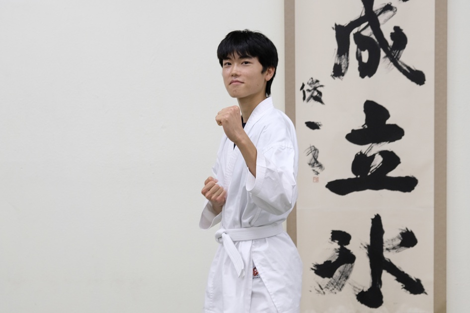 Budo Accelerator student demonstrating a martial arts stance in a dojo.
