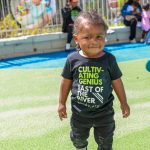 BBI school slogan t-shirt worn by toddler