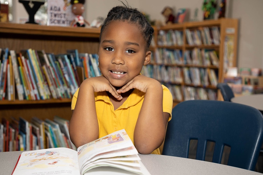 AR Kids Read proud little student with book