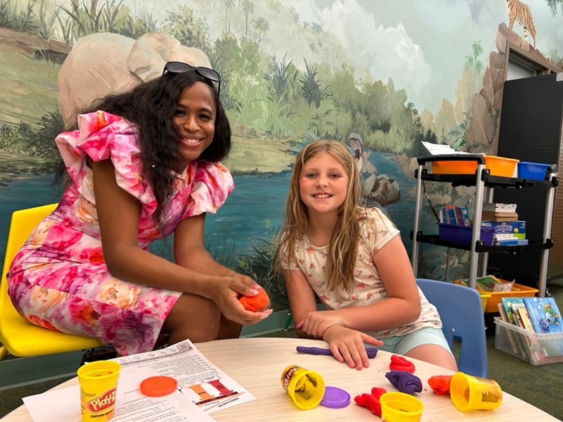AR Kids Read tutor uses playdough and cookie cutters to supplement a reading lesson
