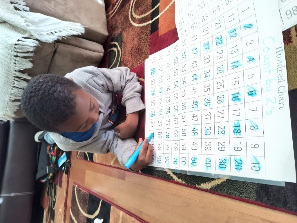 Student practicing number patterns and counting skills during personalized tutoring session