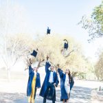 Neighborhood Degree grads toss mortarboards in air