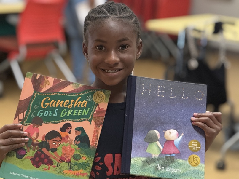 Happy AR Kids Read student shows her two new books