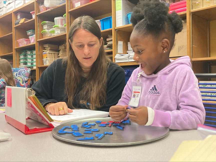 AR Kids Read tutor uses plastic letters to teach young student how to spell words