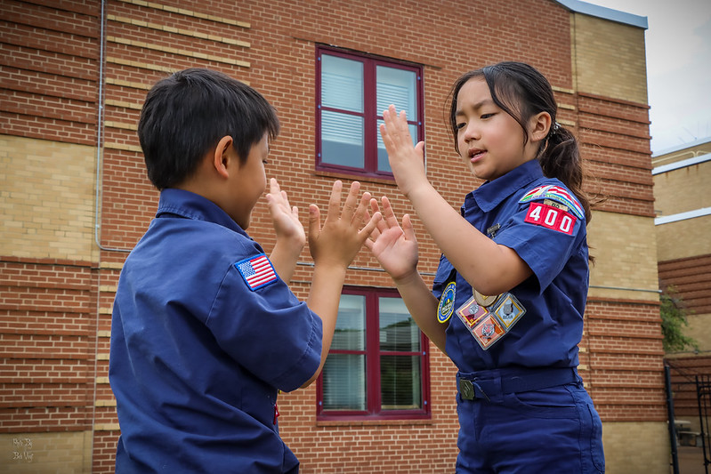 Greater St. Louis Area Scouting girl and boy scouts play clapping game