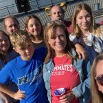 Group of mentor mentee couples outside of school in Glenwood