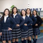 YWLA girls lined up smiling in uniform