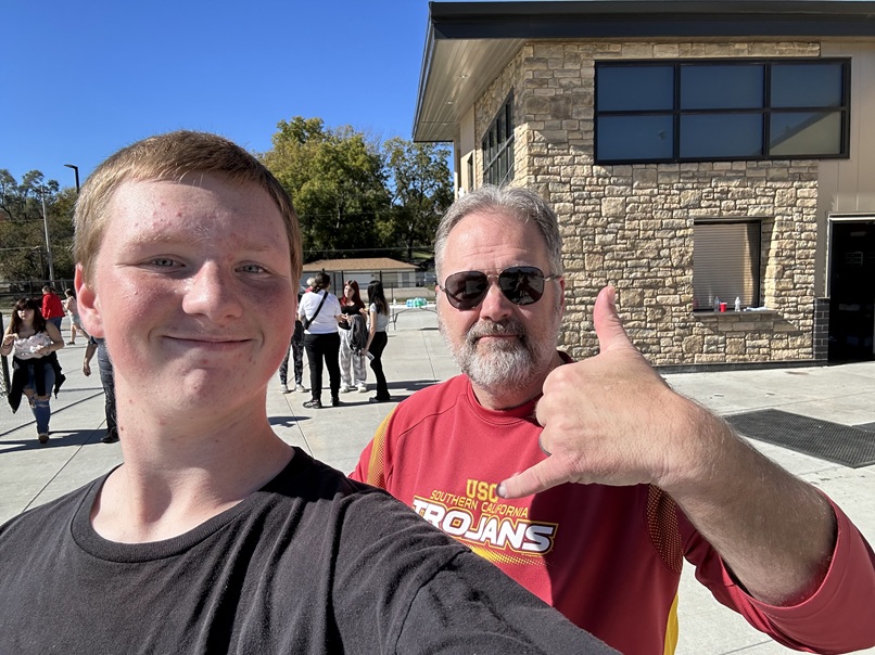male mentoring couple outside school TeamMates Glenwood