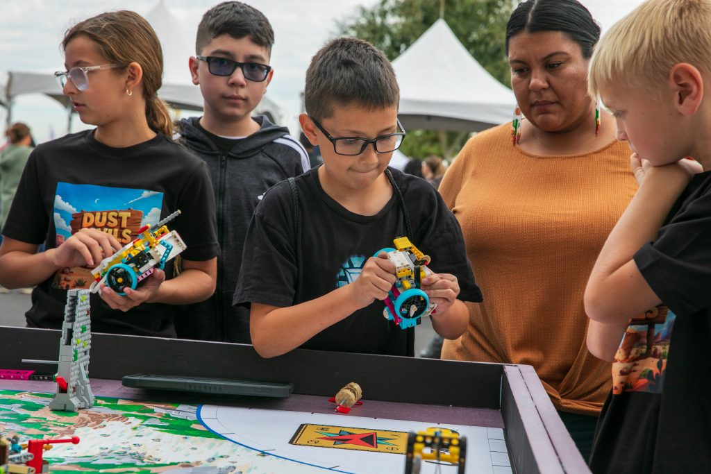 SciTech Festival boy tries out STEM activity
