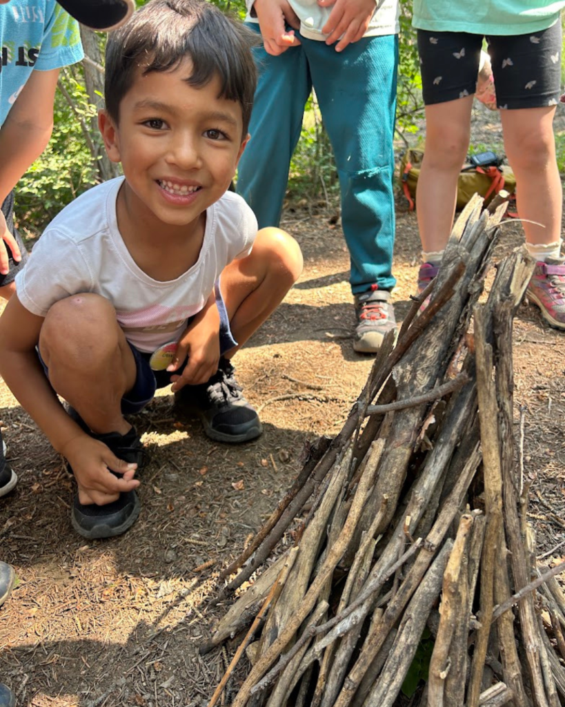 boy with sticks, Catamount Institute